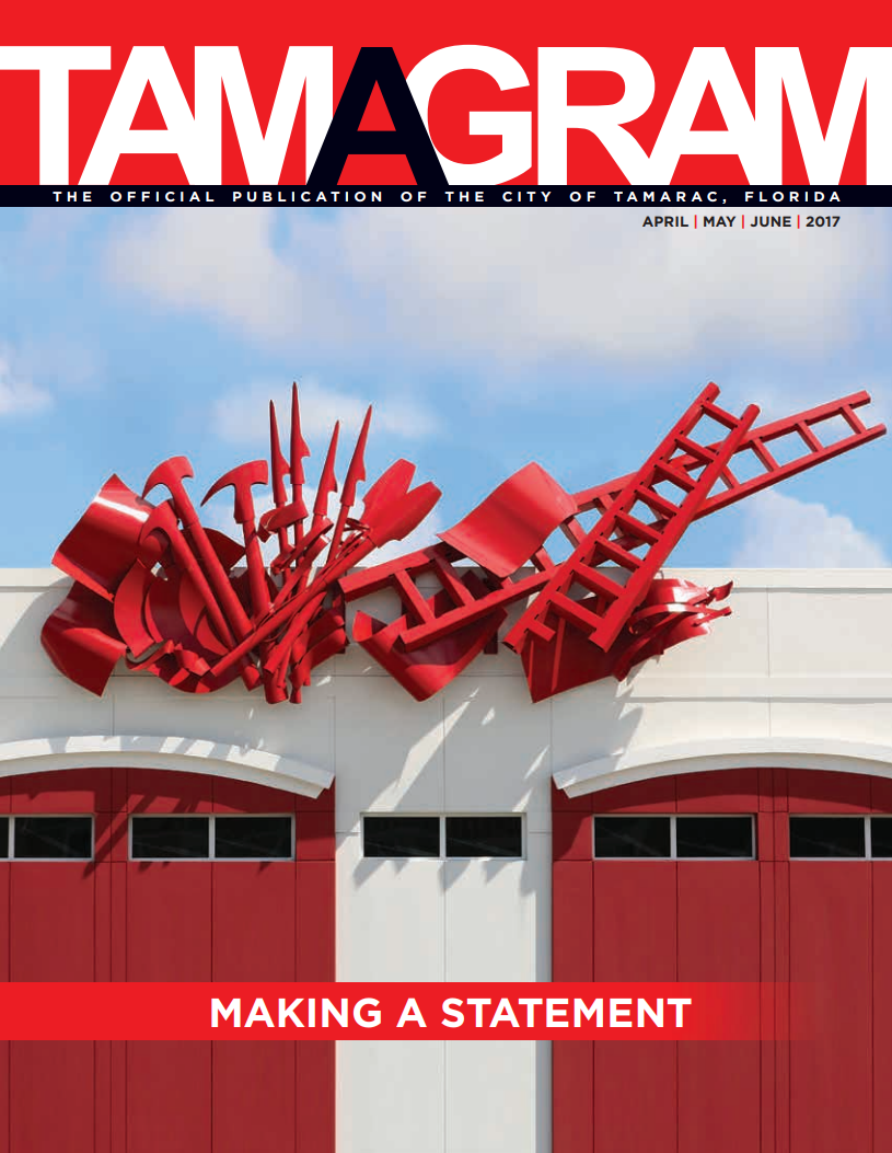 white building with red doors and a bow